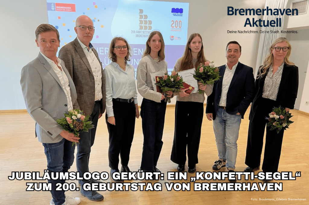 Eine Gruppe von sechs Personen steht in einem Raum mit Blumensträußen in der Hand, während sie stolz Urkunden für das Jubiläumslogo zum 200. Geburtstag von Bremerhaven präsentieren.